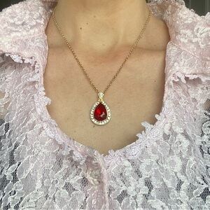 Pretty Red Glass Crystal Tear Drop Pendant Necklace 
God Tone Chain.